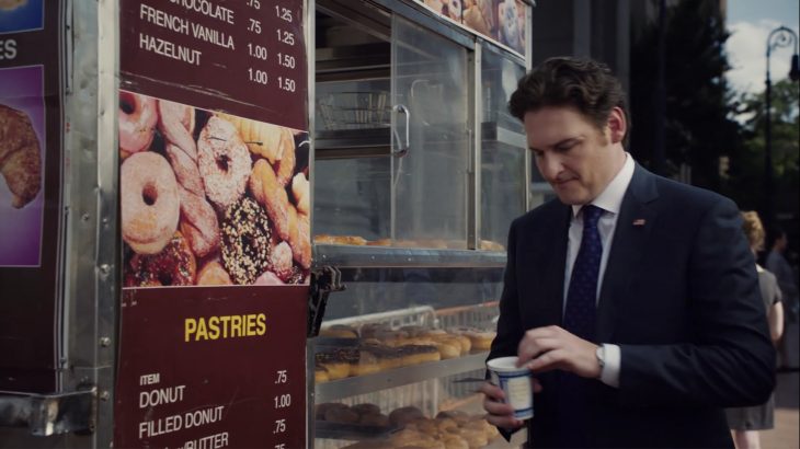 Toby Leonard Moore with an Anthora coffee cup in the TV show Billions