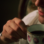 Antonio Banderas with coffee cup in Original Sin